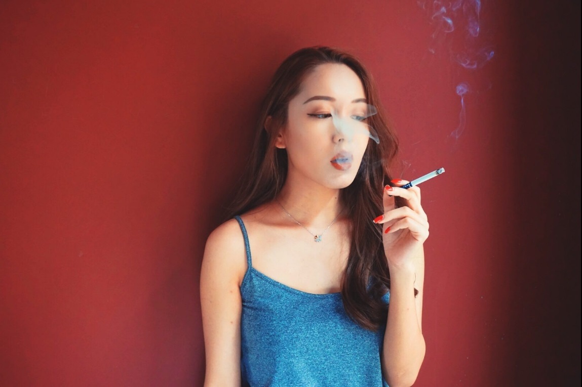 Women Smoking Cigarettes — 57